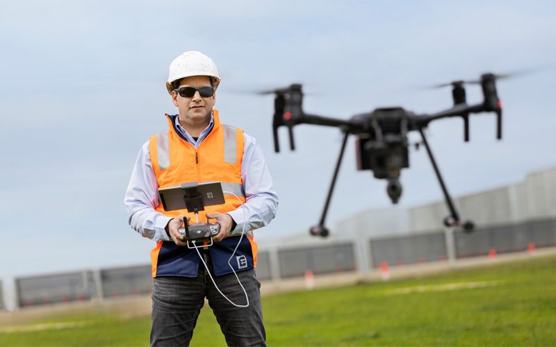 Surveyor operating a large drone